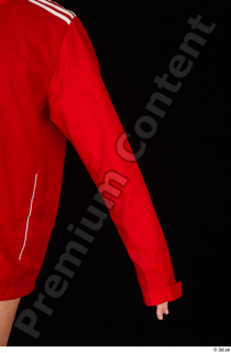 Ruby arm dressed red sports jacket upper body 0002.jpg